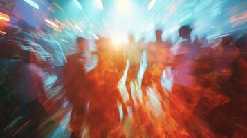 Blurred figures sway and jump in a mesmerizing display of energy and excitement representing the euphoric state of a concert crowd photo