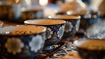 Intricate patterns adorning tea cups and utensils, adding to the visual experience of the ceremony. photo