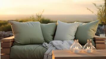 Soft, velvety couches in a calming shade of sage green invite you to relax and admire the breathtaking sunset outside, while the warm glow from the overhead lights adds a touch of photo