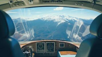 The intricate design of the controls of this private jet is complemented by the serene mountainscape visible through the window. photo