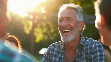 A middleaged man laughing with friends at a BBQ enjoying the simple s in life photo