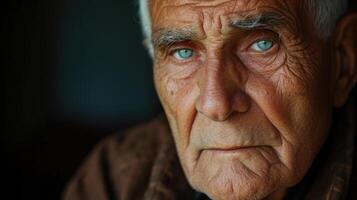 An older man with a serious expression representing the emotional complexities of aging photo