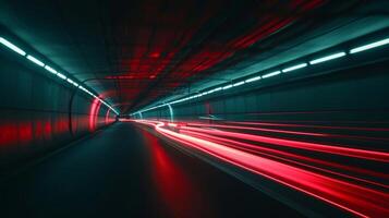 Slow motion footage of car tail lights leaving a vibrant trail of red beams as it navigates through a dimly lit tunnel. The light streaks almost seem to dance against th photo