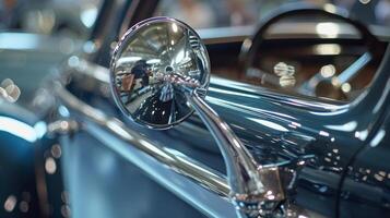 The closeup of a clic cars side mirror highlighting the polished chrome finish and elegant design of a bygone era photo