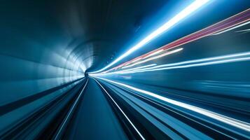 Slow pan of a car zooming past the camera in a tunnel leaving behind a trail of light that lingers for a few seconds before fading away. The contrast between the fleetin photo
