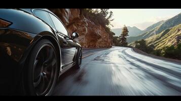 The camera p low to the ground capturing the perspective of a car as it navigates the twists and turns of the mountain road photo