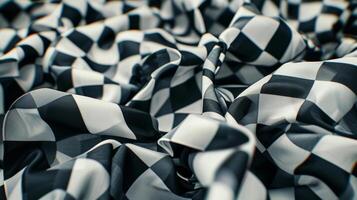 Closeup of a pile of checkered flags each one folded neatly and waiting to be used in the next race highlighting the ubiquitous presence of this symbol in the world of racing photo