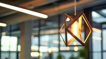 An upclose shot of a geometric lighting fixture with clean lines and warm ambient light showcasing the creativity and sophistication of this office design photo