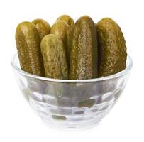 marinated cucumbers on white photo