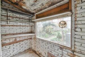 A room with a window and a shelf in it photo