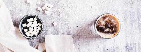 Trendy fluffy coke with marshmallow in glasses on the table top view web banner photo