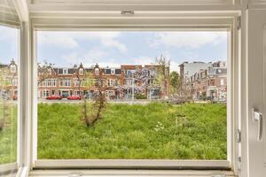 A window with a view of a grassy field photo