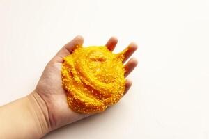 The child plays with slime elastic mass photo