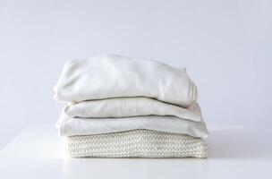 Stack of folded colorful clothes. Compact storage organizing photo