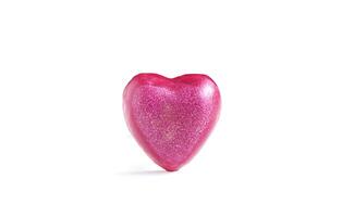 Heart shaped bar of soap on a light soft background. Top view. photo
