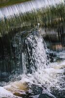 Flowing water on Bastion hill in Riga, Latvia, East Europe photo