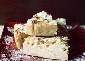 Homemade sweet apple pie with cinnamon and and powdered sugar. photo