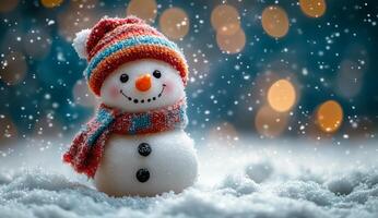 A snowman with a red hat and scarf is smiling in the snow. The image has a cheerful and festive mood, as it captures the joy of winter and the fun of building a snowman photo