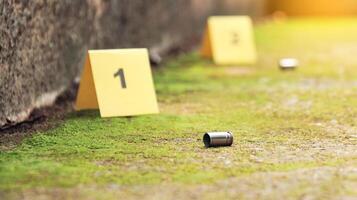 Spent bullet casing lying on the ground with blur number 1 sign. Concepts of shooting sports and security highlighting the dual nature of firearms in both competitive sport and protective measures. photo