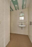 A bathroom with a sink and a mirror photo