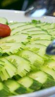 slicing cucumbers fresh cucumbers. chopped cucumber top view video