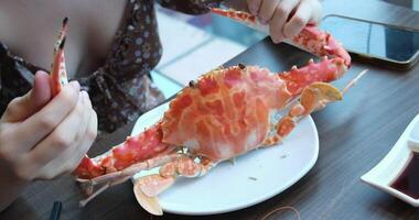 Hands holding a steam cooked crab without top shell. Slow motion. Close up. video