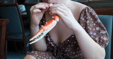 Hands holding a steam cooked crab without top shell. Slow motion. Close up. video