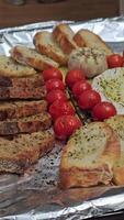 Delightful various types of white cheese and crispy fresh bread with pieces of wood on rustic table video