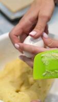 Choux pastry for eclairs. Making small eclairs with help of pastry bag. Piping choux dough for eclairs on baking paper. Slow motion. video