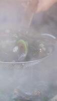 toss shells slow motion shot tosses mussels with butter in pan video