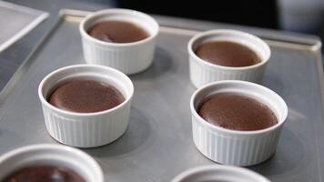 chocolate fondant making process. Step by step mixing ingredients close up Cooking chocolate fondant, pouring into molds, process video