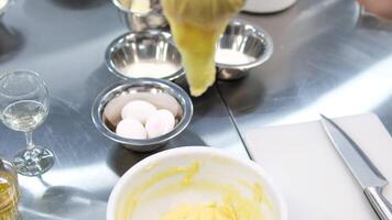 Choux pastry for eclairs. Making small eclairs with help of pastry bag. Piping choux dough for eclairs on baking paper. Slow motion. video