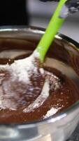 chocolate fondant making process. Step by step mixing ingredients close up Cooking chocolate fondant, pouring into molds, process video