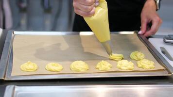 recipe step by step stuff profiteroles with cheese cream with microgreens. Profiteroles with shrimp, cream cheese and cucumber on a plate. Close-up on blue background, copy space video