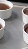 chocolate fondant making process. Step by step mixing ingredients close up Cooking chocolate fondant, pouring into molds, process video