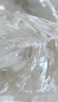 chunks of ice Pieces of ice with frozen air bubbles in the glass. Ice for a drink. video