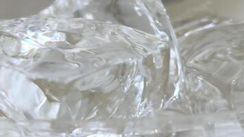 chunks of ice Pieces of ice with frozen air bubbles in the glass. Ice for a drink. video