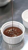 chocolate fondant making process. Step by step mixing ingredients close up Cooking chocolate fondant, pouring into molds, process video