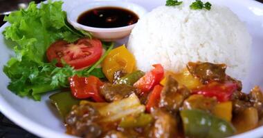 Mixed vegetables, carrots, beans, and potatoes are mixed with fried rice of adding fried mixed vegetables with rice in a pan close-up .4k.Fry Organic Vegetables. video