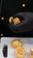 recipe step by step stuff profiteroles with cheese cream with microgreens. Profiteroles with shrimp, cream cheese and cucumber on a plate. Close-up on blue background, copy space video