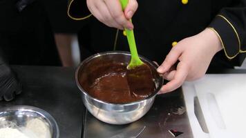chocolate fondant making process. Step by step mixing ingredients close up Cooking chocolate fondant, pouring into molds, process video