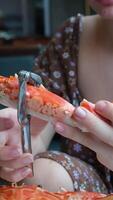 Hands holding a steam cooked crab without top shell. Slow motion. Close up. video