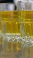 apple juice in a glass beautiful background showing the shadow of a glass of juice among apples. Pouring delicious aromatic apple juice. High quality 4k footage video