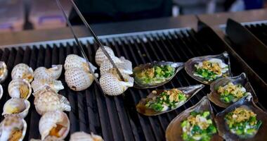 grill scallop with cheese, shells with green onions video