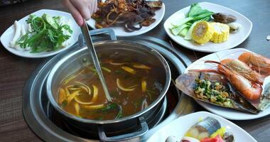 broth with vegetables Stirred ladle chicken with noodles and potatoes cold soup in a small saucepan on the gas stove near the window video