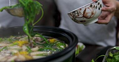 Asian Herb Soup. use a ladle to scoop up soup and put it in a bowl. Arabic soup with herbs video