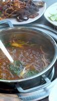 boiling broth live cooking lamb stew in central java Indonesia with sweet soy sauce video