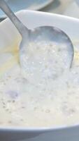 dessert in a glass liquid buffet the opportunity to scoop liquid dessert with jelly candies from a common plate into a glass video