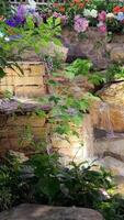 Artificial waterfall in the temple Made from stones of various sizes. Bonded with cement in layers when water is released to hit each floor. Very realistic and beautiful video