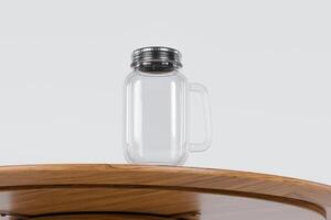 Transparent glass mug jar with stainless steel metal lid and handle placed on a wooden table. Suitable for branding your product with quality 3d rendering. Empty drinking glass, realistic mock-up photo